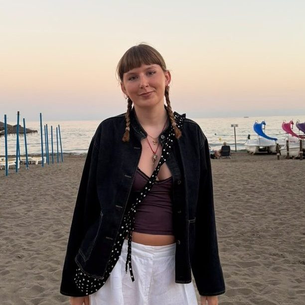 Erin standing on a beach